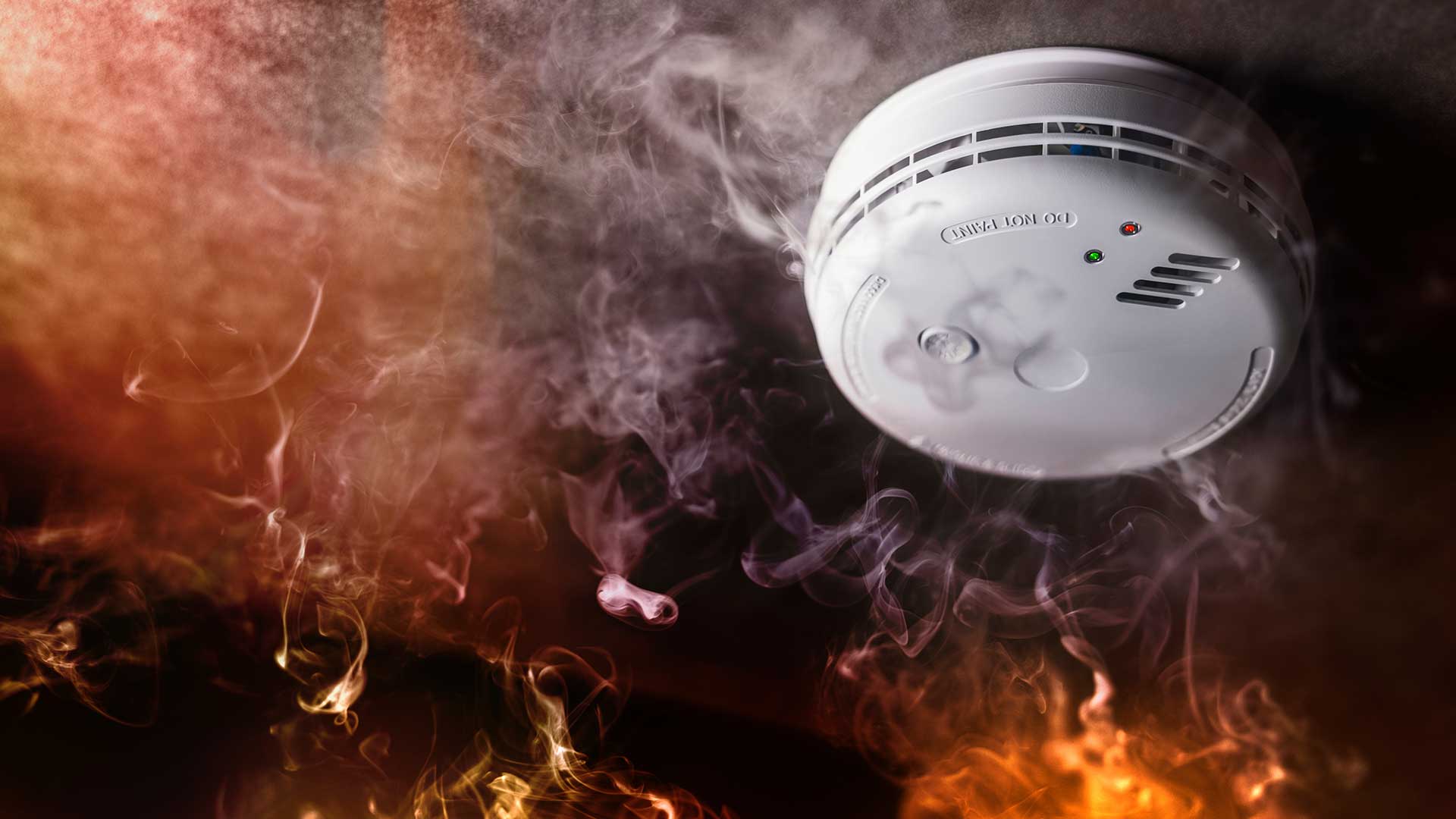 Image of smoke alarm activating to warn people of a fire.
