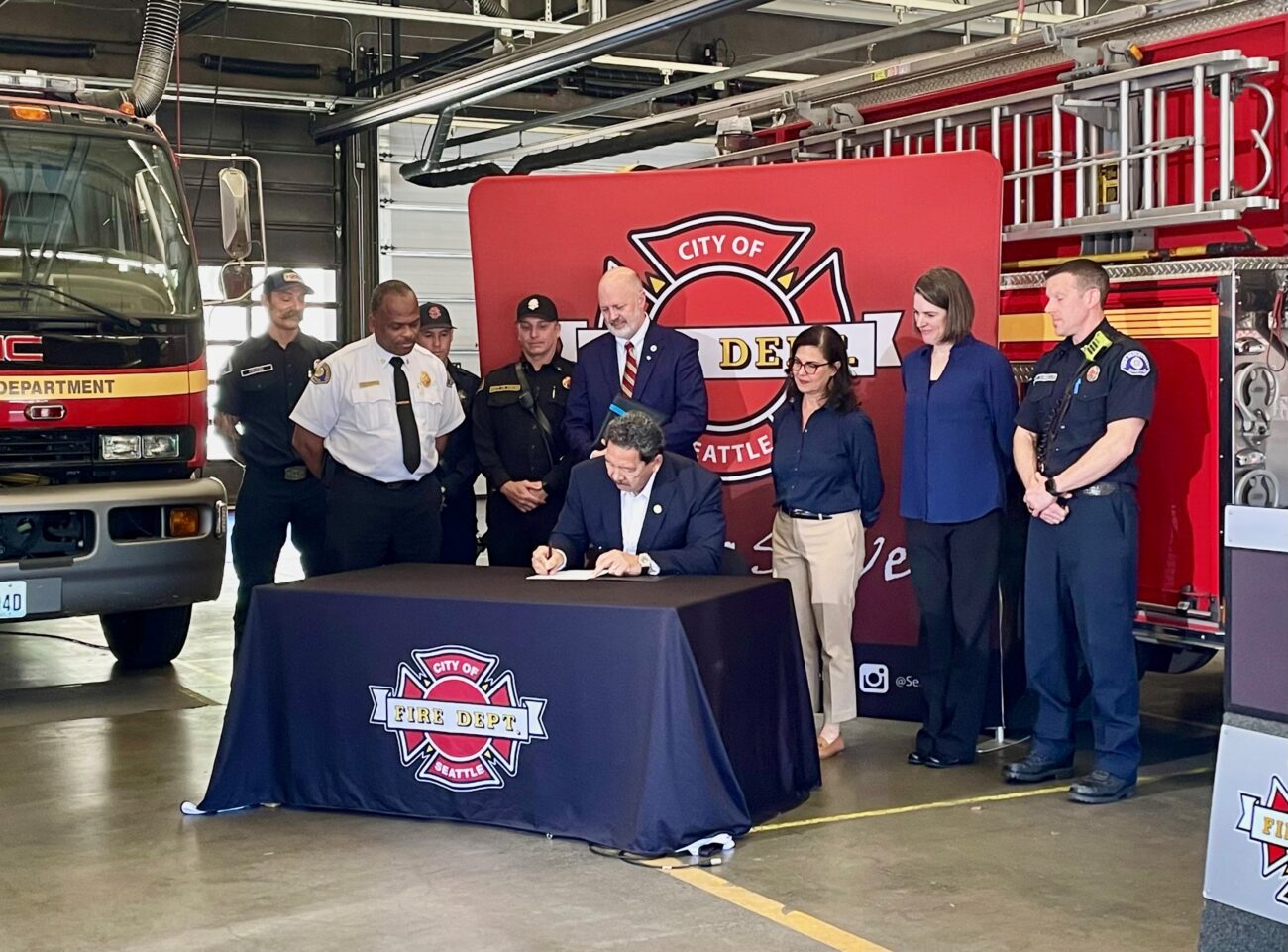 Seattle Mayor Bruce Harrell signing legislation to expedite demolition and remediation of dangerous vacant buildings in Seattle