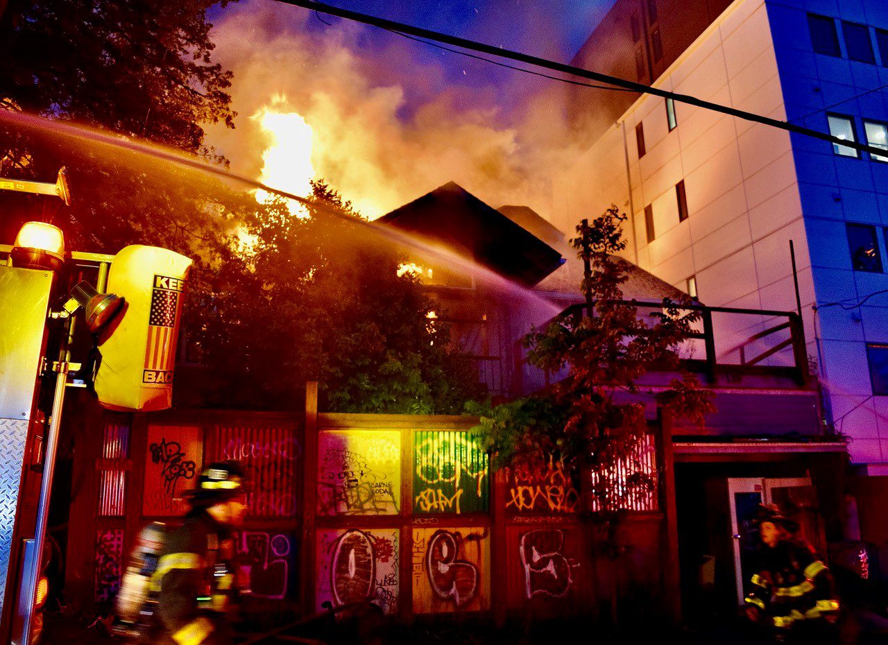 Firefighters responding to a fire in a vacant residence.