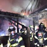 Firefighters work to extinguish a 2-alarm fire