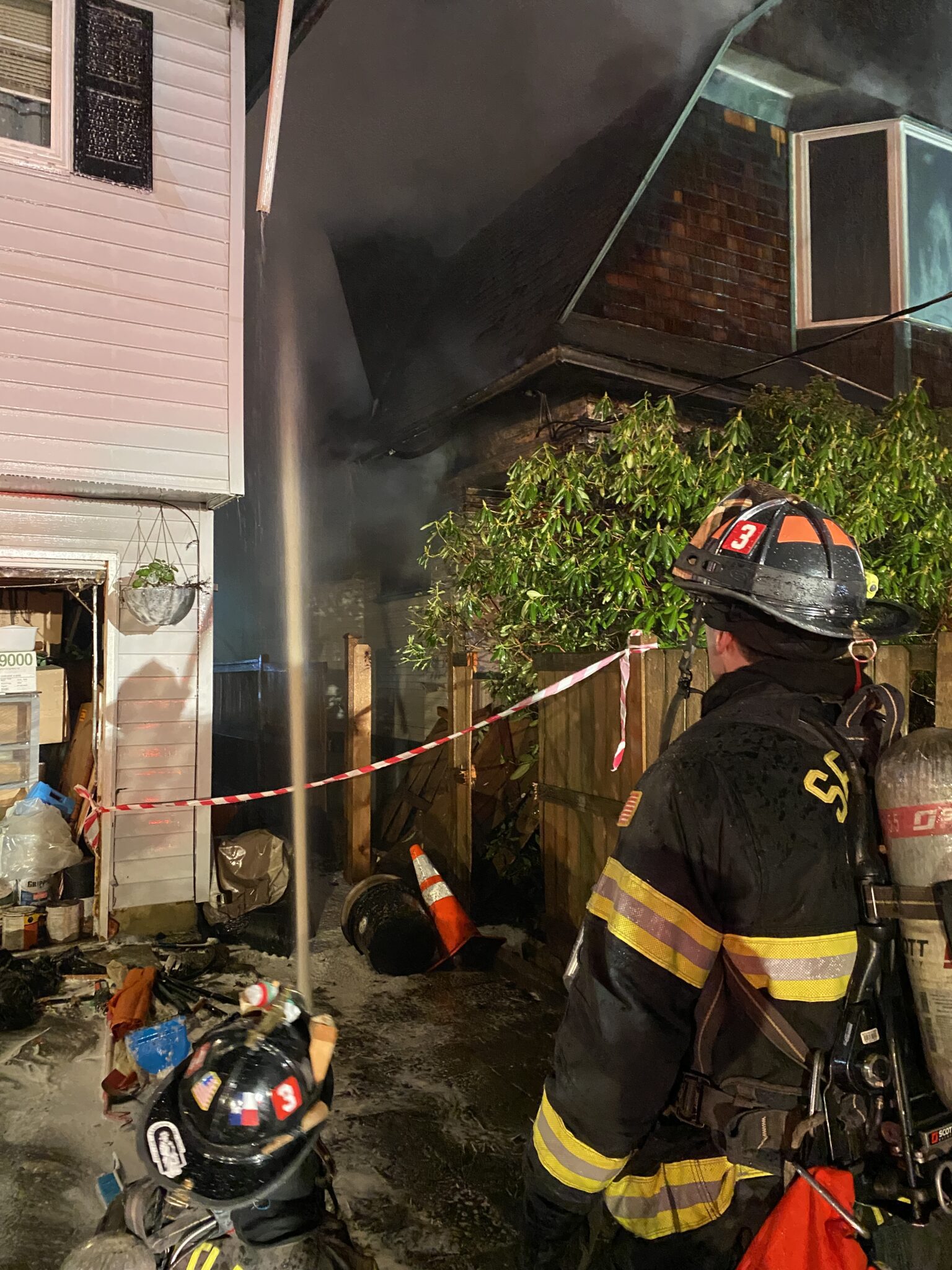 Firefighters putting water on a fire.