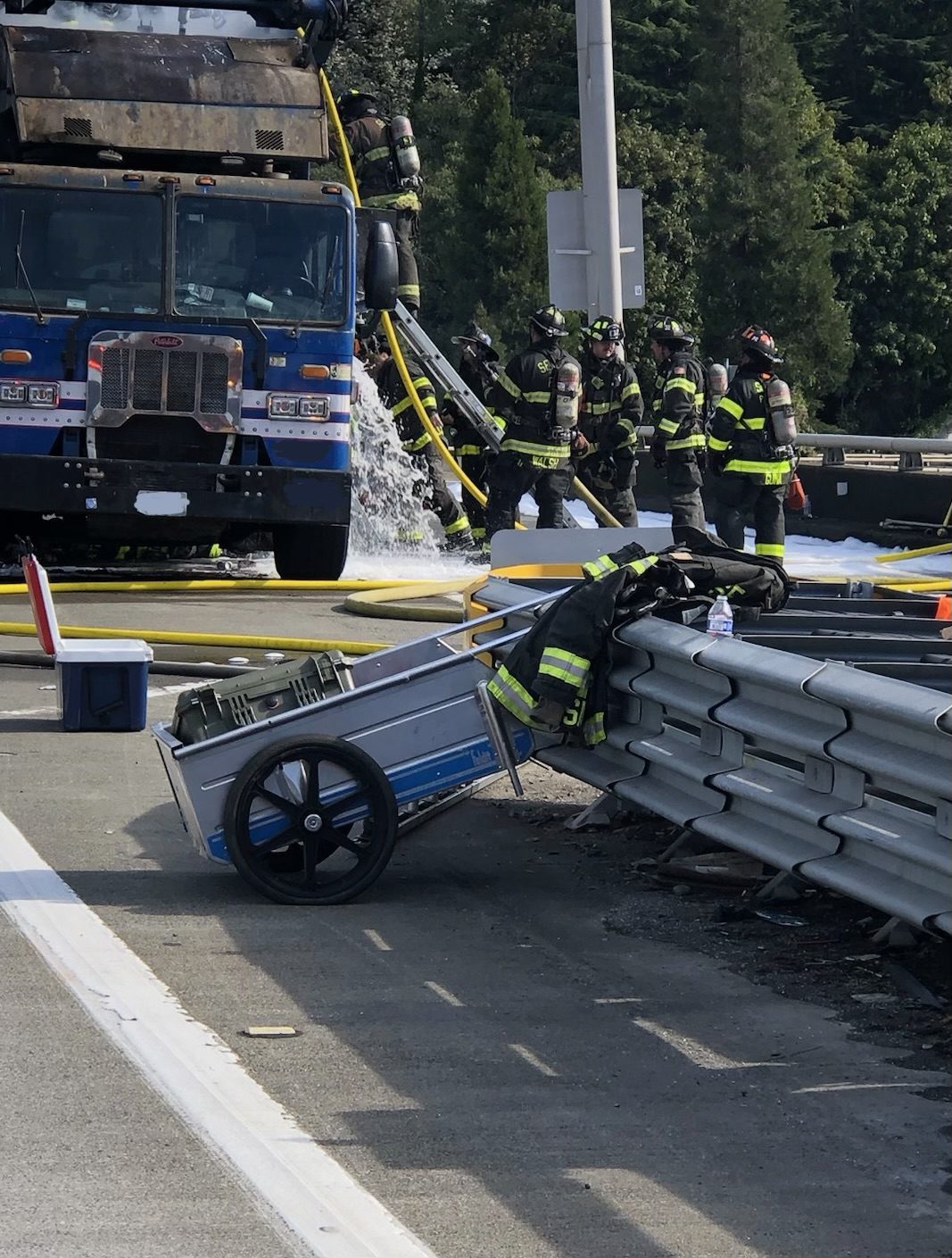Two Seattle Fire specialty teams help extinguish a complex garbage truck fire on I-5