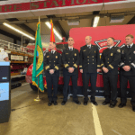 Seattle Fire members being promoted standing together.